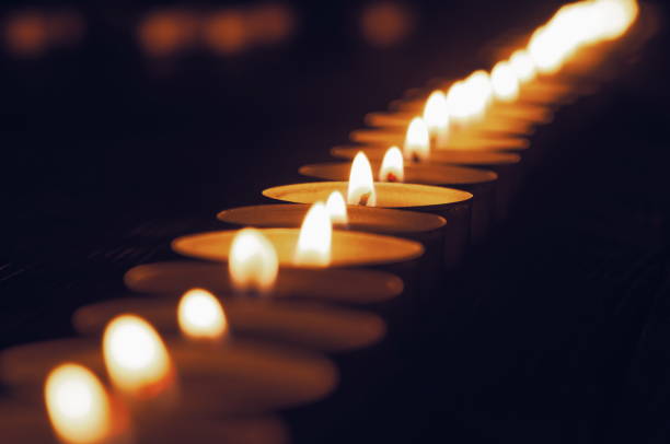 istock memory of the dead burning candles in the dark 1302744749