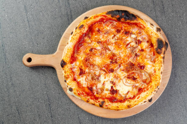 istock Baked pizza with bacon, mozzarella and onion 1302746911