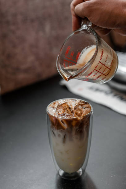 istock Glass of coffee on the table 1302748348