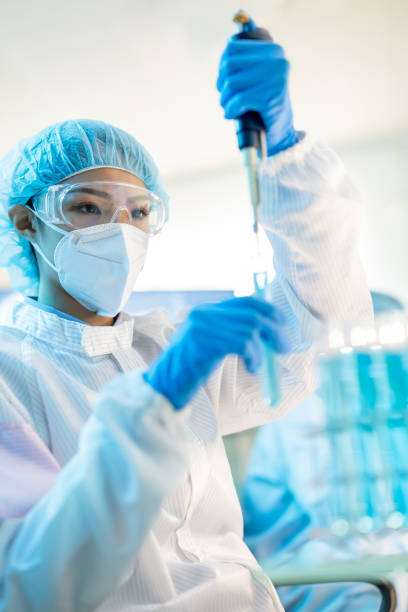 istock asian scientist take test tube 1302749420