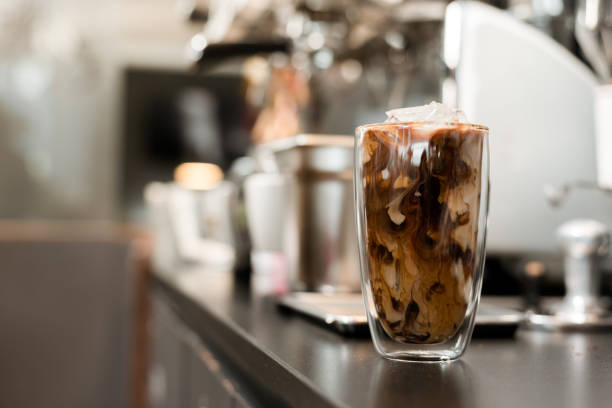 istock Glass of coffee on the table 1302749626