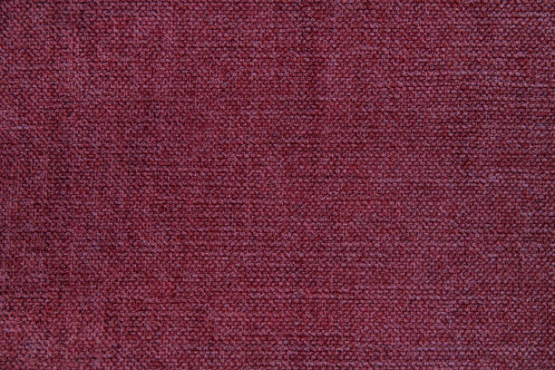 Wooly tapestry in solid garnet color, homely background with copy space, concept for home decoration