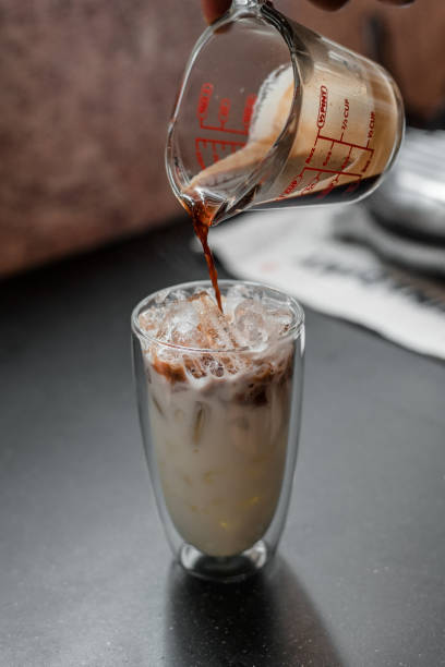 istock Glass of coffee on the table 1302751405