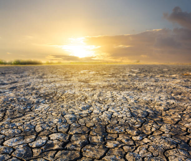 istock dramatic sunset over a dry saline land 1302754377