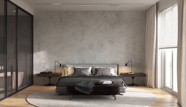 istock Minimalism modern interior design bedroom with panoramic windows.  Glass partition separates bedroom from bathroom. Contemporary bed with  bedside bench. 3d rendering. 3d illustration. 1302755475