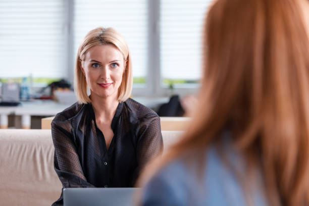 istock Confident female professional in office meeting 1302755624