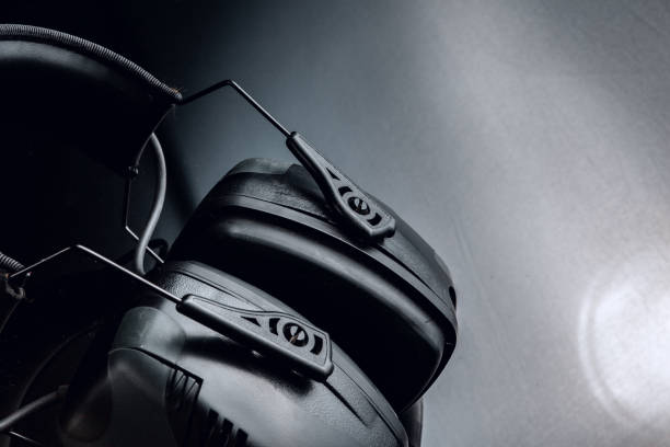 istock Black headphones for shooting on black background 1302758880
