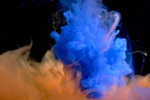 istock Fluid art. Abstract background. Blue-orange flow on black. 1302760286