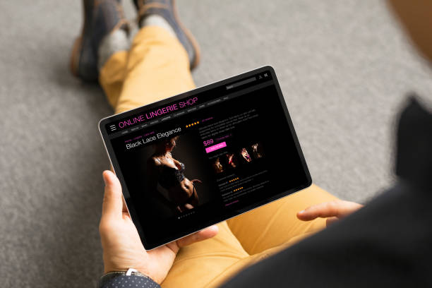 istock Man browsing lingerie store's website 1302760728