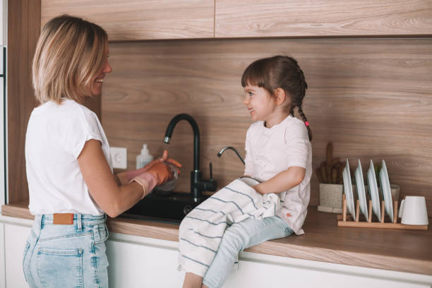 istock Washing the dishes together 1302760883