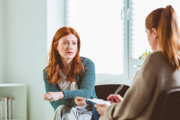 istock Woman sharing problems with psychotherapist 1302762660