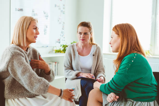 Females discussing in group therapy session