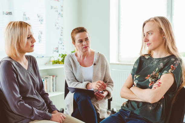 istock Females discussing in group therapy session 1302762861