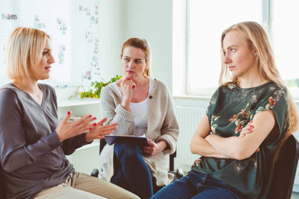 istock Females discussing in group therapy session 1302762937