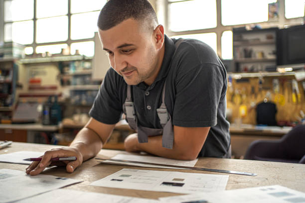 istock Male engineer developing blueprint in a factory 1302763062