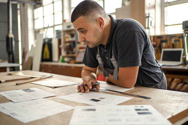 istock Male engineer developing blueprint in a factory 1302763288