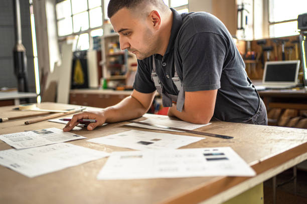 istock Male engineer developing blueprint in a factory 1302763306