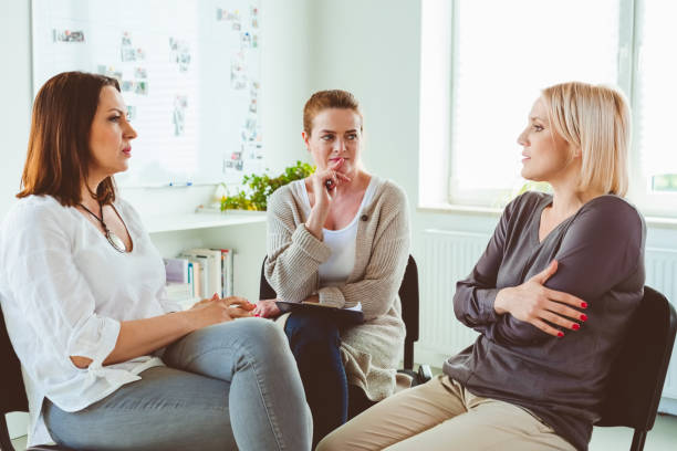istock Women discussing in group therapy session 1302764019