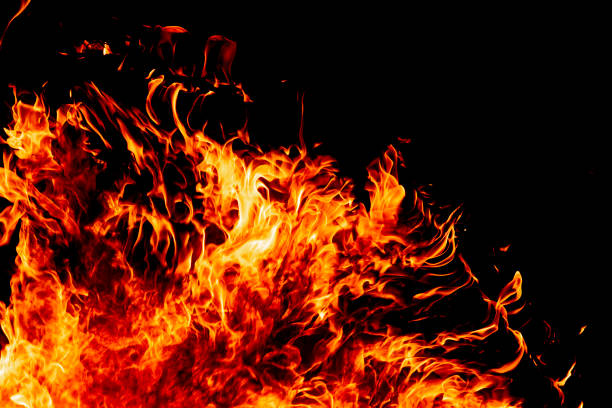 istock Fire on a dark background. Background from fire. Fire close up. Background for designers.Wood fire on black background 1302764103