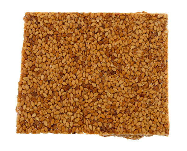 istock Piece of sesame seed crunch on a white background 1302765129