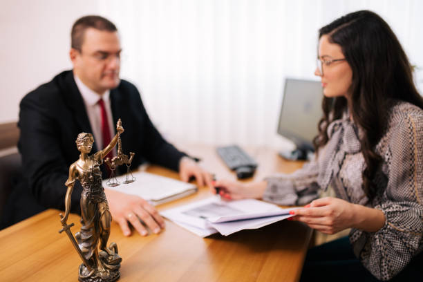 Lawyer with the client Young female client at lawyers office notary photos stock pictures, royalty-free photos & images