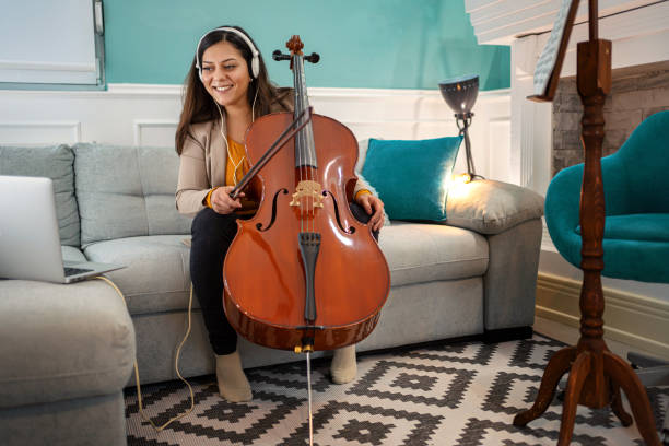 istock Young woman playing cello 1302765233
