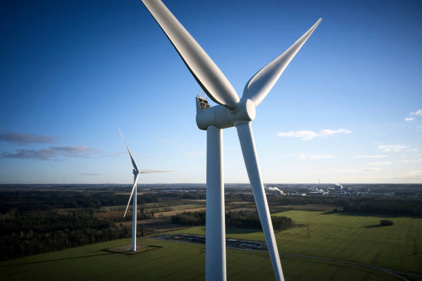 istock Big white windmills seen closeup 1302766794