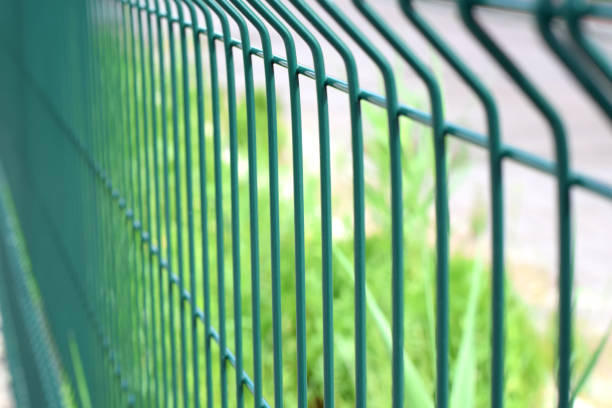 istock Green steel wire fence with rods 1302766850
