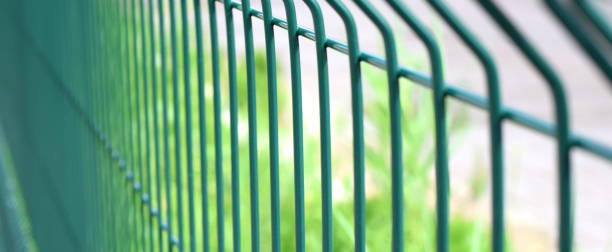 istock Green steel wire fence with rods 1302767135