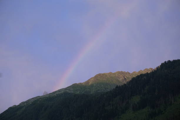 istock rainbow in the French Alps 1302767923