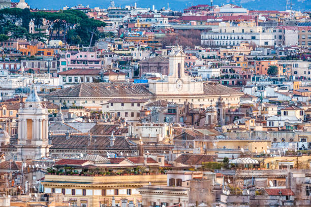 istock Panoramic view of Rome, roofs, churches and pines 1302769214