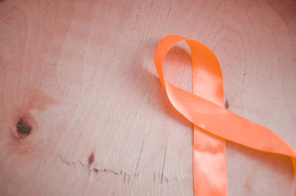 istock Orange awareness ribbon. The problem of attention deficit hyperactivity disorder. Emotional Disorder and Behavioral Disorder 1302769751