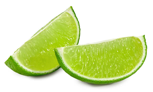 istock cut of green lime isolated on white background. clipping path 1302770718