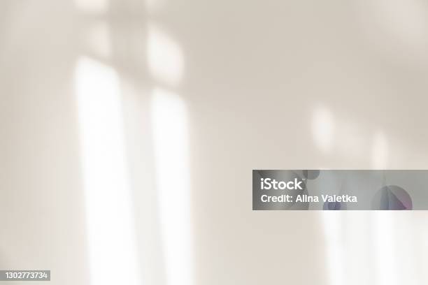The Light From The Window Shines On The White Wall The Shadow From The Curtain Stock Photo - Download Image Now
