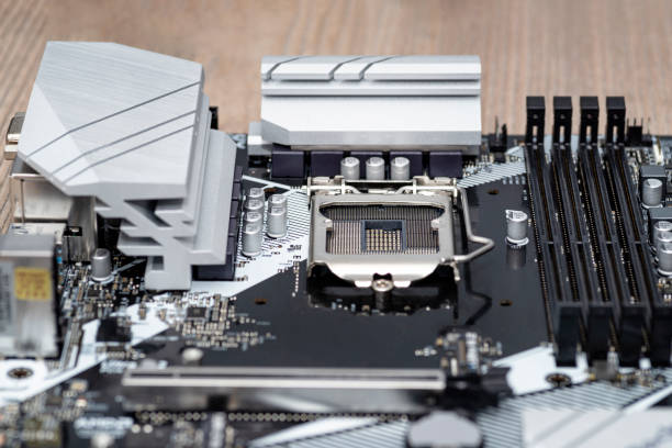 istock A modern desktop motherboard in black color with a visible socket 1200 for the CPU, memory slots DDR4 and heat sinks. 1302774262