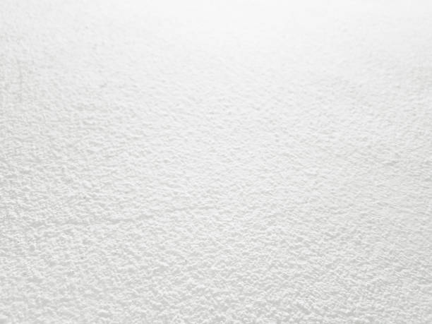 istock White cement wall background in vintage style for graphic design 1302775486