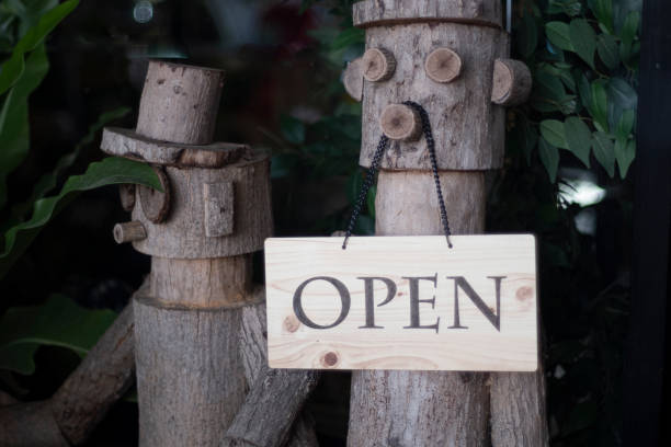 Open Sign Hanging on wooden doll decoration cafe restuarant