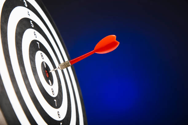 istock Darts arrows in the target center 1302778954