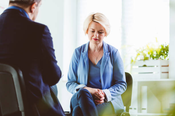 istock Businesswoman talking to coach during session 1302779944