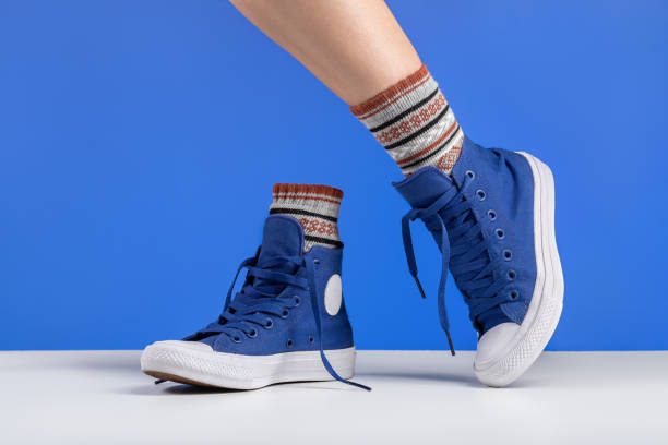 istock Two new colored socks and sneakers for the flyer. 1302779981