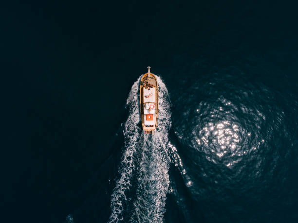 istock Top view of a sailing ship with people. 1302780546