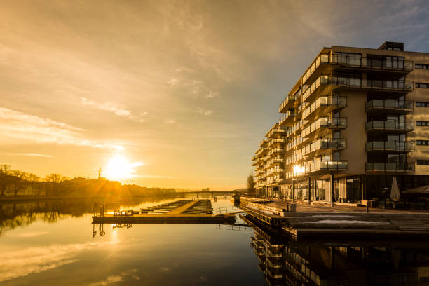 Sunrise in Drammen Sunrise in Drammen, Norway with new apartment buildings just next to Drammenselven (Drammen river) østfold stock pictures, royalty-free photos & images