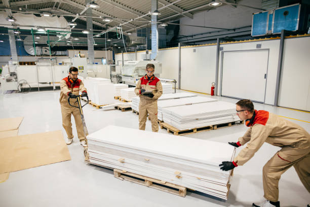 istock Senior manager supervising carpenters during their work in a workshop 1302782334