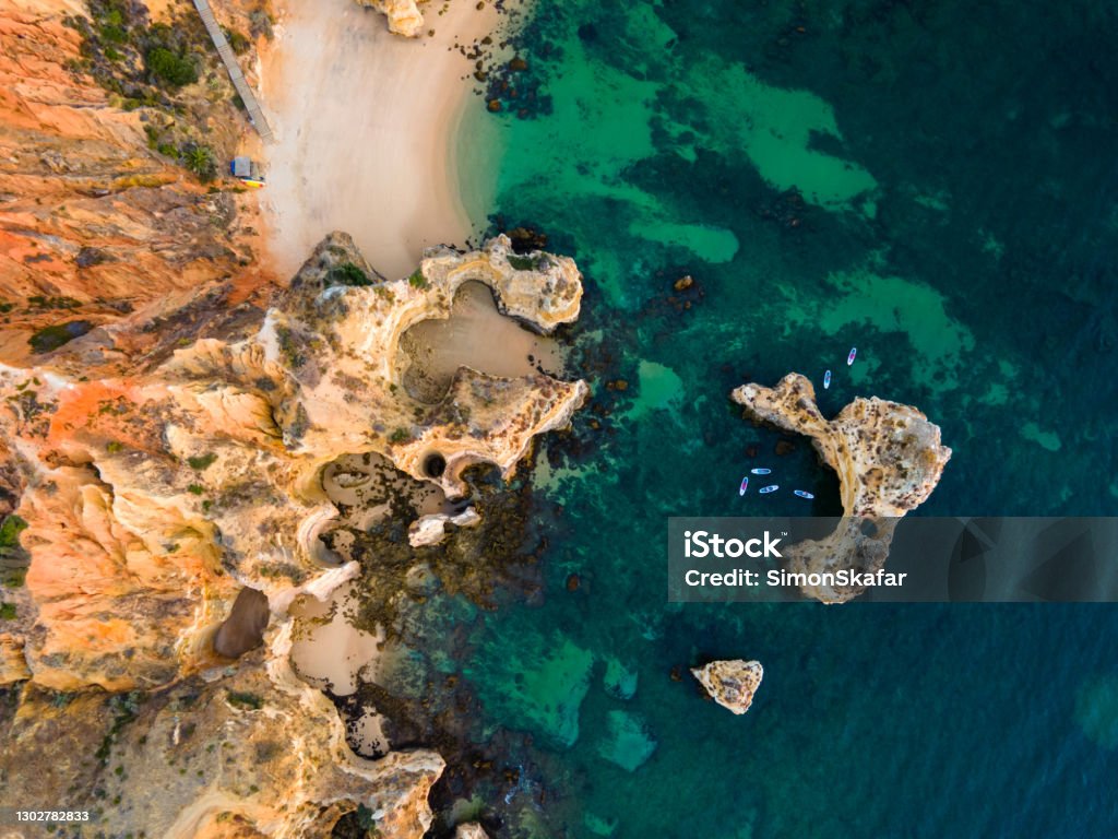 Cliffs with rock formations at Ponta da Piedade Rock formations at beach along coastline of Ponta da Piedade Algarve Stock Photo