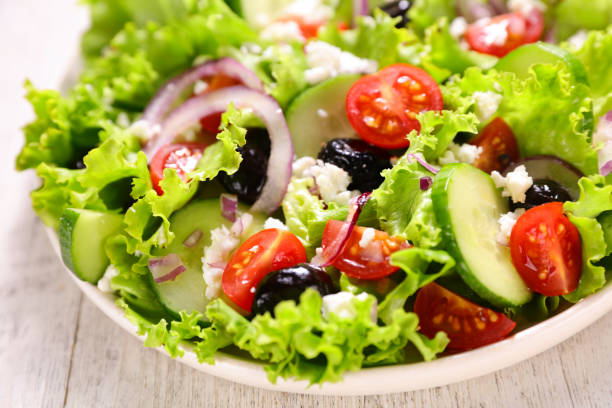 istock vegetable salad with tomato, cucumber and olive 1302784359
