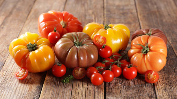 istock assorted of tomatoes on wood background 1302784372