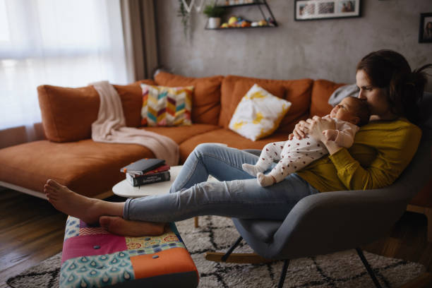 istock Single mom bonding with her newborn baby daughter 1302785492