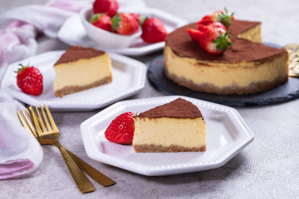istock Tiramisu cake with strawberries on gray stone background. 1302787023