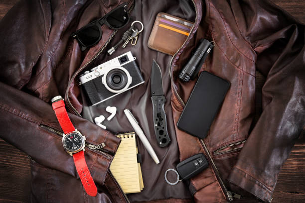 istock EDC or Every Day Carry items laid out on leather jacket 1302787118