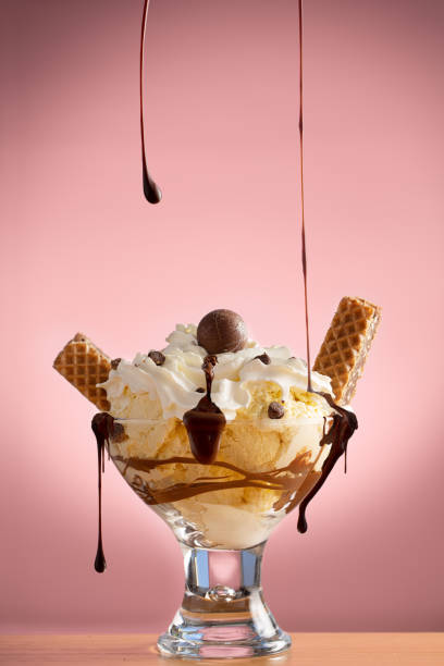 istock Prepared Chocolate Ice-cream Sundae with spilling chocolate syrup 1302787394